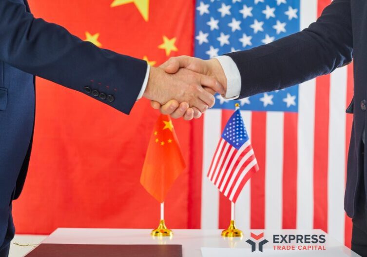 Untitled (800 x 527 px) Business handshake in front of U.S. and China flags, representing the 2025 tariff reduction and trade negotiations, with Express Trade Capital logo in view.